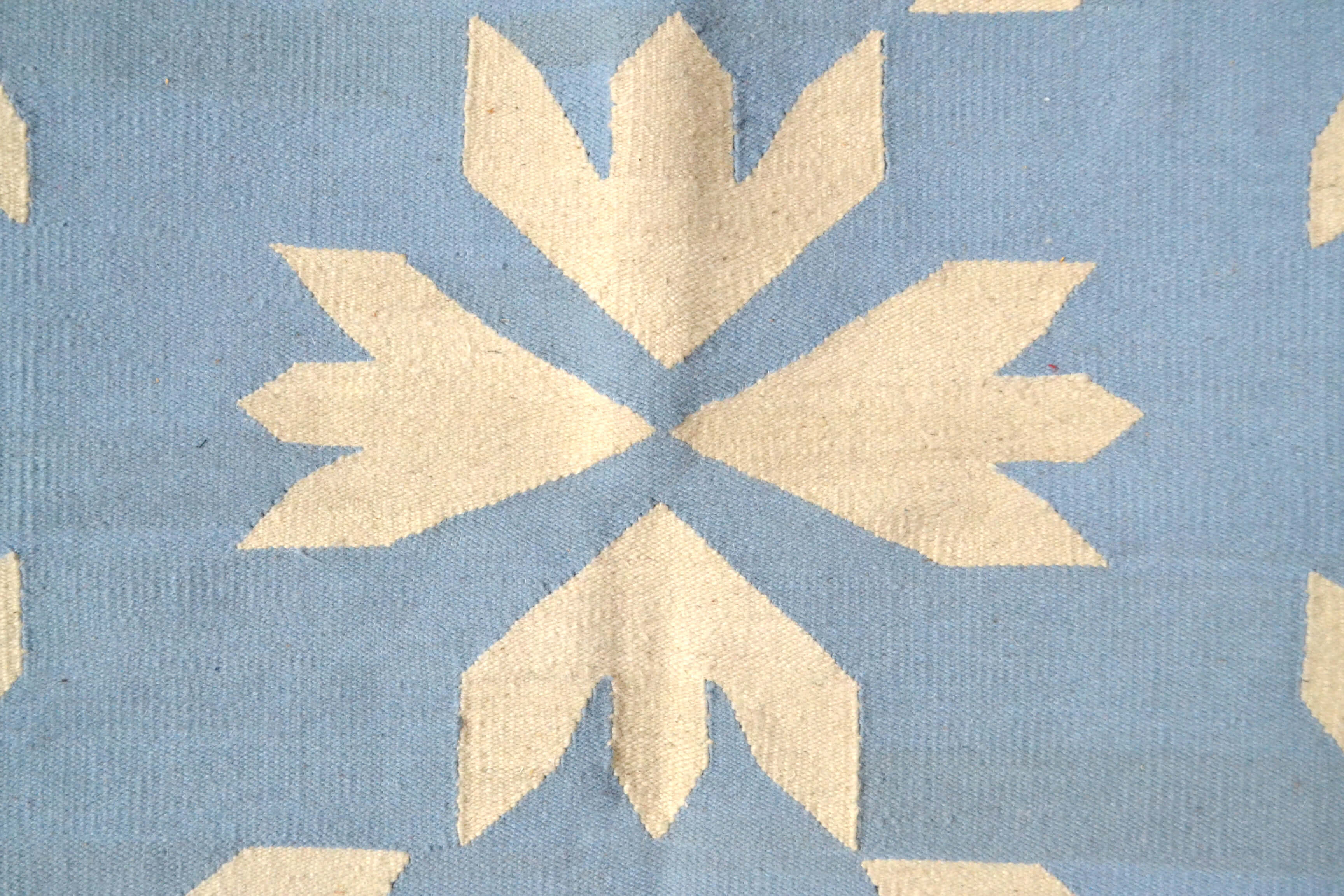 Bloom blue wool kilim accent rug by Yuba Mercantile