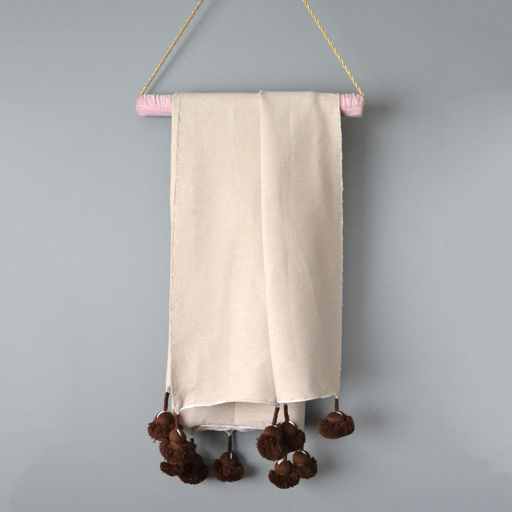 Natural Cotton Throw with Chocolate Brown Pom Poms from Yuba Mercantile