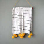 Black and White Striped Moroccan Throw with Golden Pom Poms by Yuba Mercantile