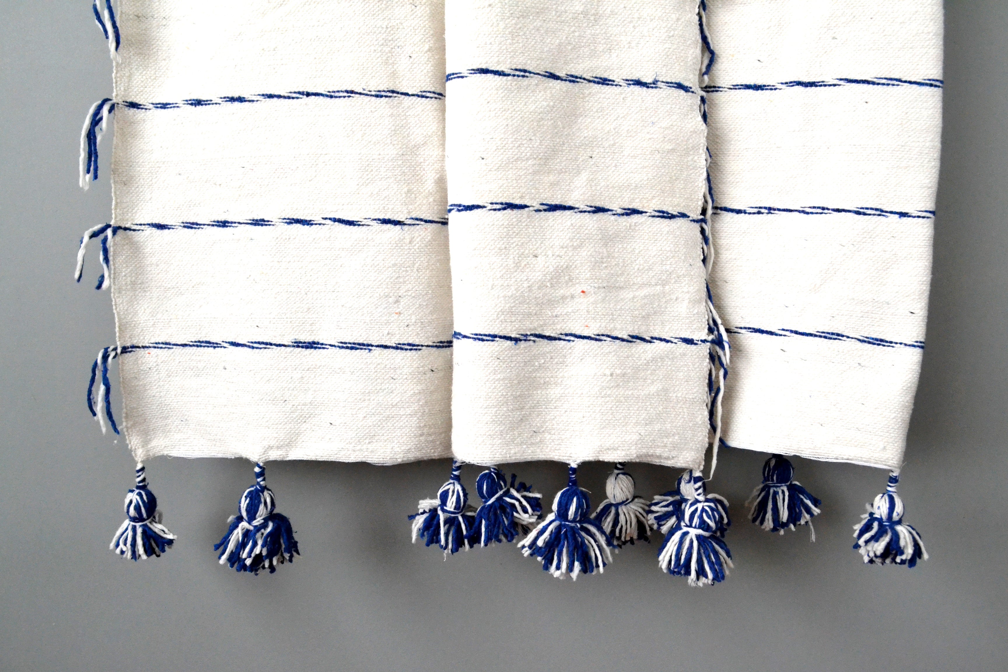 Blue and Ivory Fringe Pom Pom Cotton Throw by Yuba Mercantile